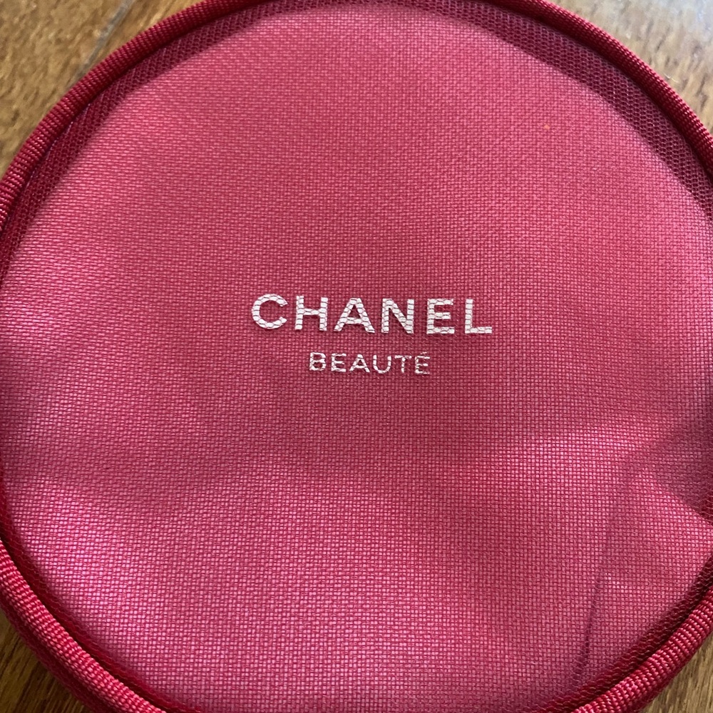 A Chanel beauty red mesh make up bag round great condition